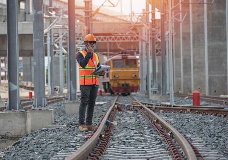 Engineer on railways. engineer train on the railway.Worker walk on railway. engineer railway concept.infrastructure,rails,engineer